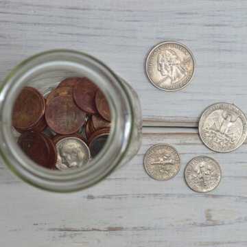 Coins in Jar. 5 Tips for a Fast Budget Fix