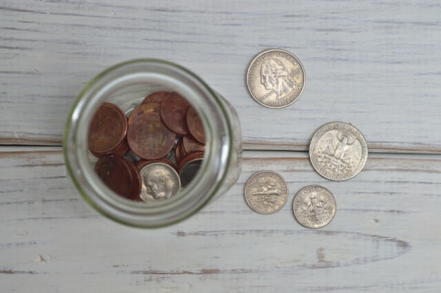 Coins in Jar. 5 Tips for a Fast Budget Fix