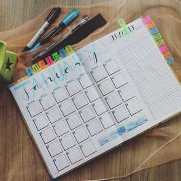 Photo of planner and pens. Tracking irregular bills