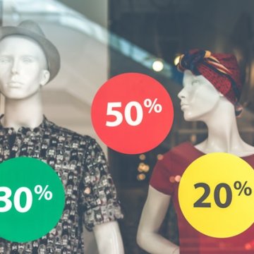50% 30% 20% signs on store window. 50/30/20 budget review